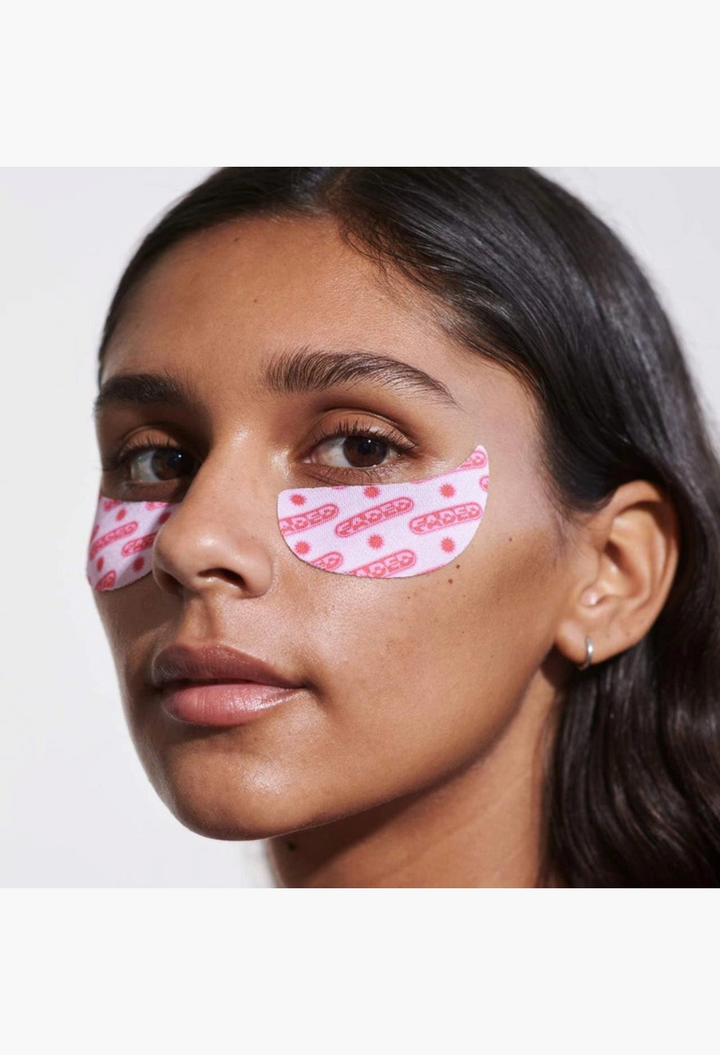 GLAM MODA Topicals Faded pink hydrogel under eye masks on a woman to brighten dark circles and discoloration