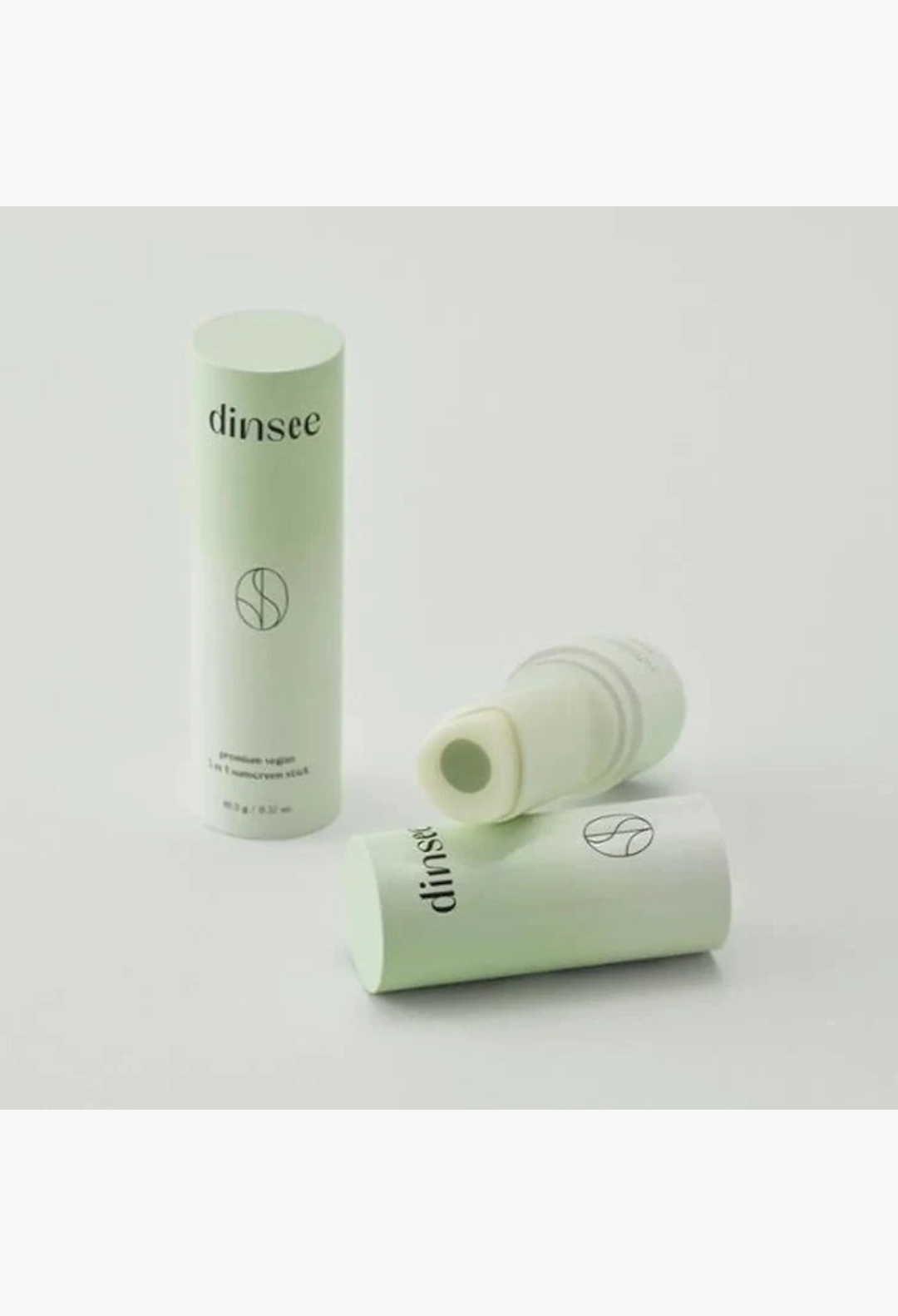 GLAM MODA Dinsee vegan 3-in-1 sunscreen stick with SPF50+ PA++++ in a light green compact tube