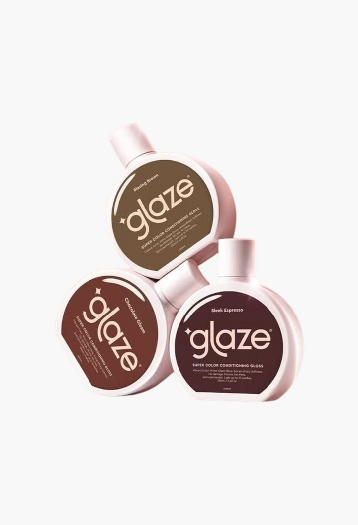 GLAM MODA Glaze Super Color Conditioning Gloss bottles in various brown shades with reflective studio background