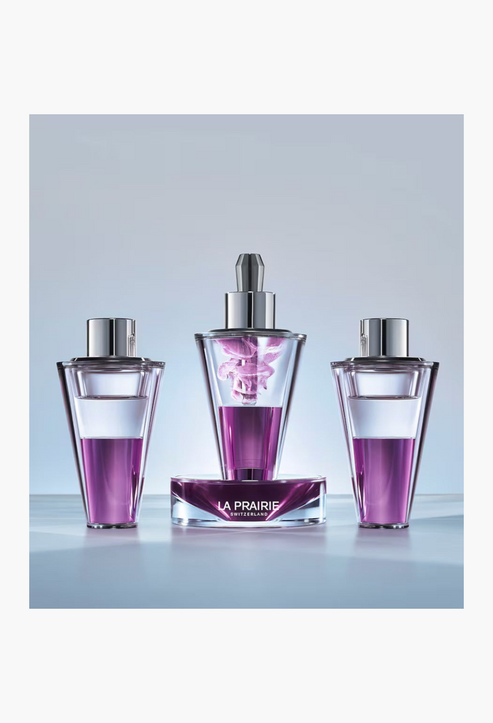 GLAM MODA La Prairie Platinum Rare Haute-Rejuvenation Protocol set featuring three purple serum vials and a base.