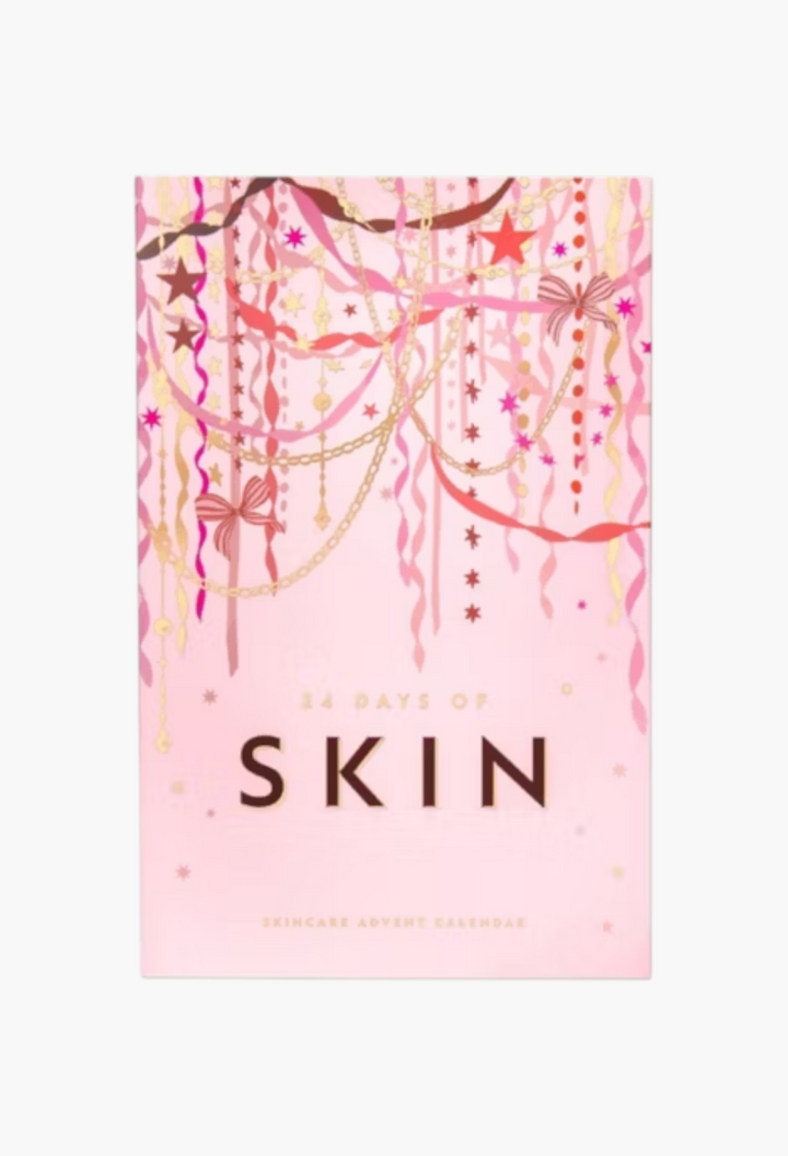 GLAM MODA 24 Days of Skin advent calendar in a festive light pink box with gold and pink ribbon and star decorations.
