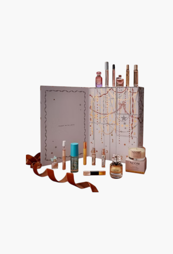 GLAM MODA 12 Days of Scent fragrance advent calendar featuring luxury perfume miniatures and a NEOM scented candle.