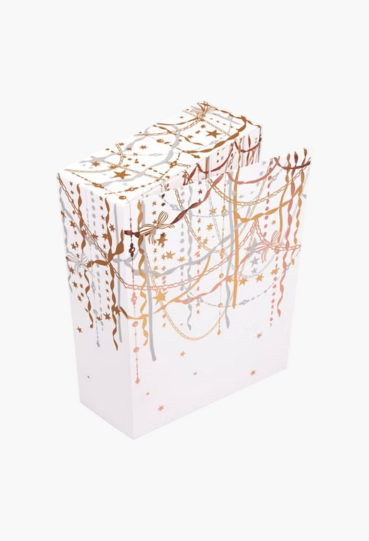 GLAM MODA 12 Days of Scent fragrance advent calendar in a white keepsake box with gold and silver festive decorations.