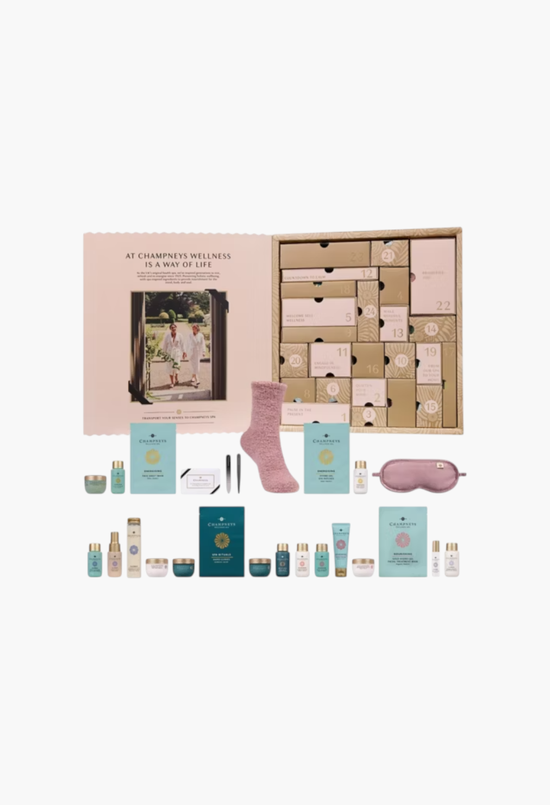 GLAM MODA Champneys 24 Days of Spa Glow Advent Calendar with skincare products, fluffy socks, and spa accessories.