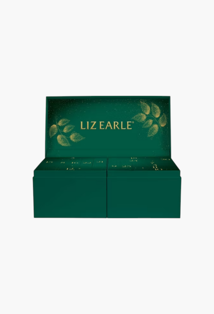 GLAM MODA Liz Earle 24 Days of Beauty Advent Calendar in a festive dark green box with gold leaf detailing.