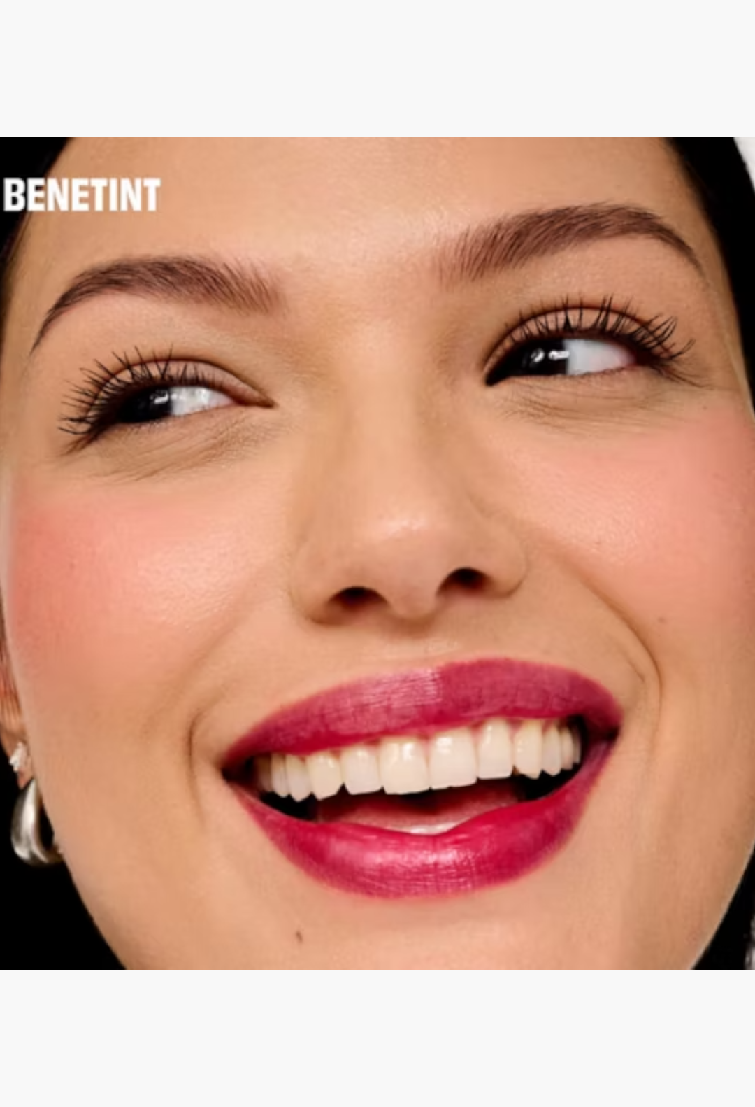 GLAM MODA model smiling with radiant skin, wearing Benetint rose-tinted lip and cheek stain for a natural glow