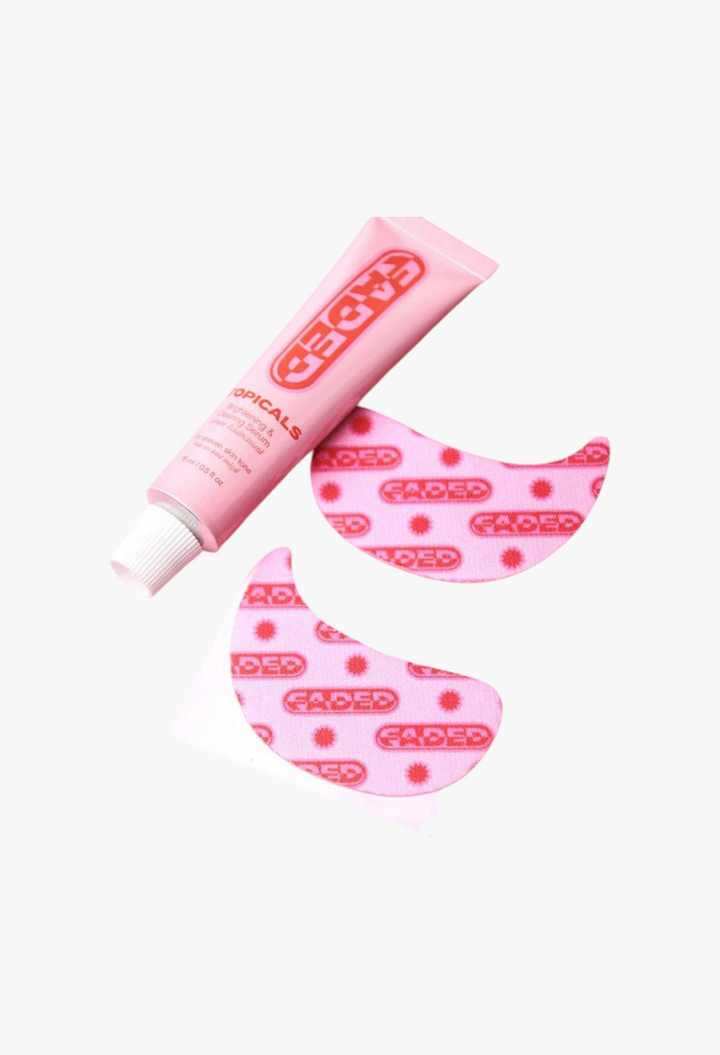 GLAM MODA Topicals Faded pink hydrogel under eye masks and brightening serum tube on a matching pink background