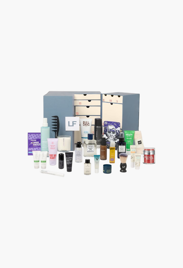 GLAM MODA grooming advent calendar featuring a collection of skincare, haircare, and shaving products in a blue box