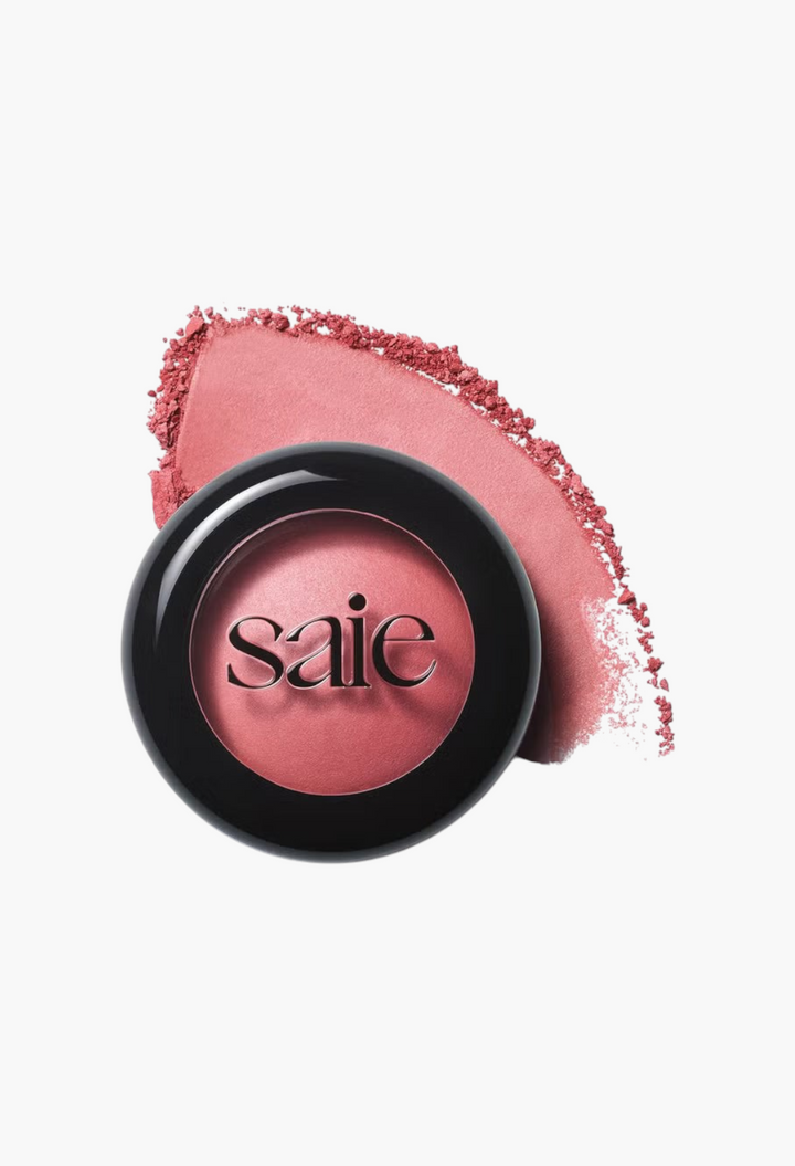 GLAM MODA Saie SuperSuede Radiant Blush powder in a sleek black compact with a soft pink pigment swatch