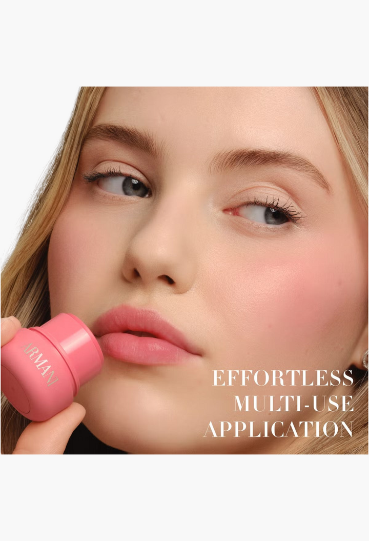 GLAM MODA model applying pink Armani Dolci Blush stick to lips and cheeks for a natural, radiant flush of colour.
