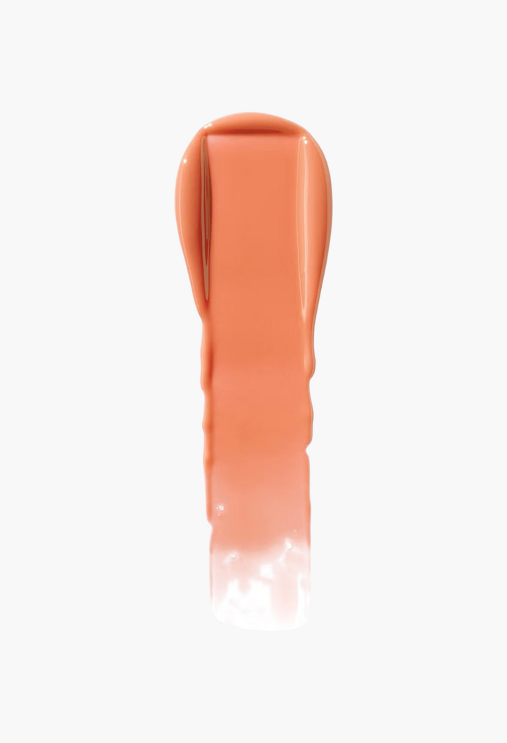 GLAM MODA VIEVE Lip Dew swatch showing a smooth, glossy peach-toned lip oil texture on a plain background.