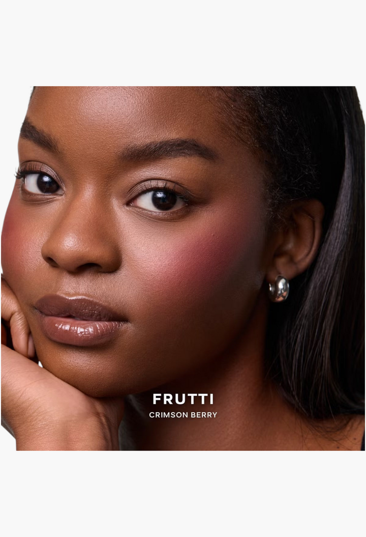 GLAM MODA model wearing Saie SuperSuede Radiant Blush in Frutti Crimson Berry for a natural glowing cheek flush