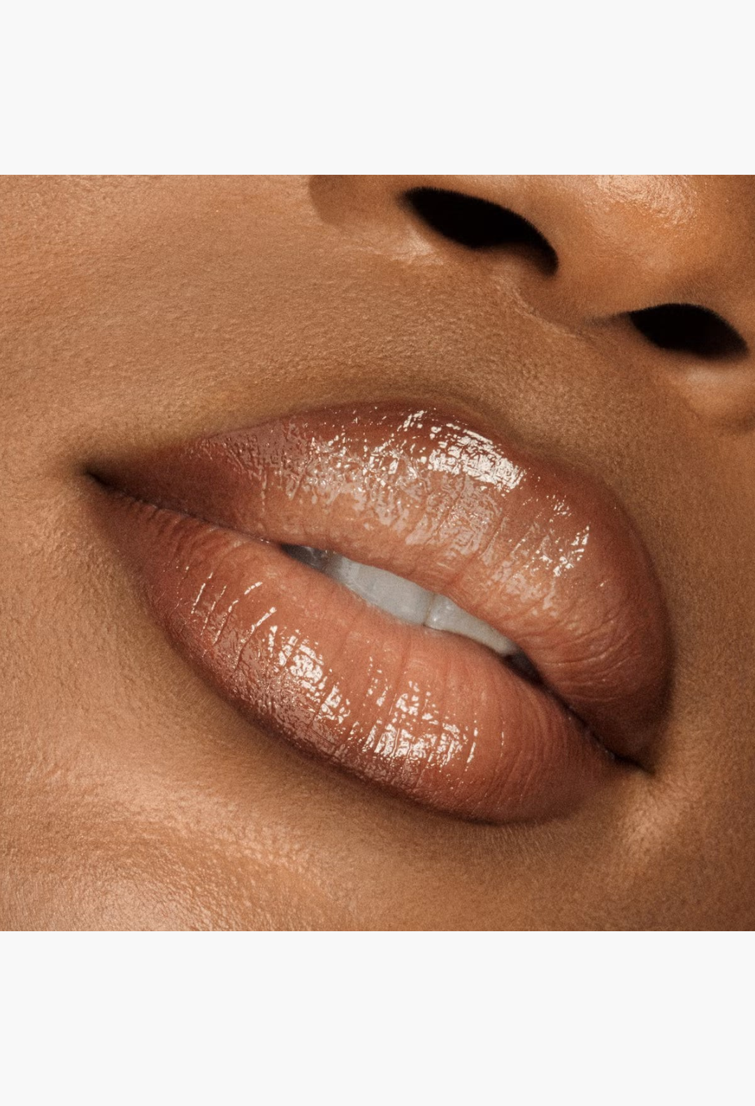 GLAM MODA VIEVE Lip Dew applied on lips for a high-shine, luminous, and non-sticky glossy finish.