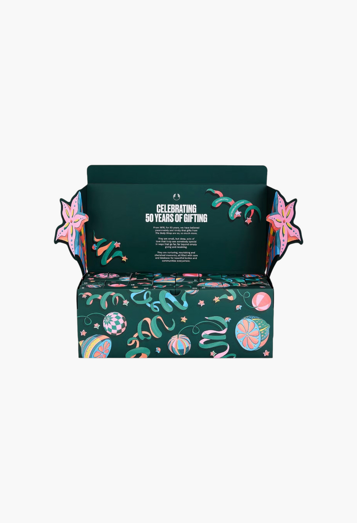 GLAM MODA The Body Shop Core Advent Calendar with festive green packaging and colourful ribbon and star illustrations.