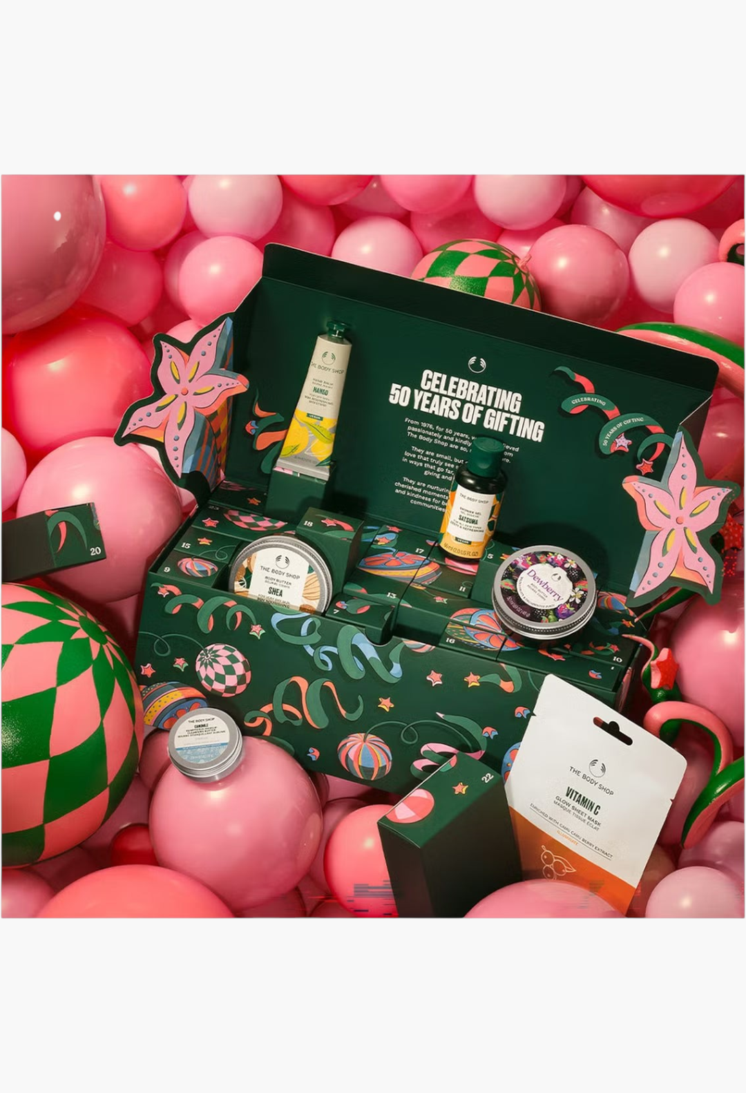 GLAM MODA The Body Shop Core Advent Calendar featuring skincare and body care treats surrounded by festive balloons.