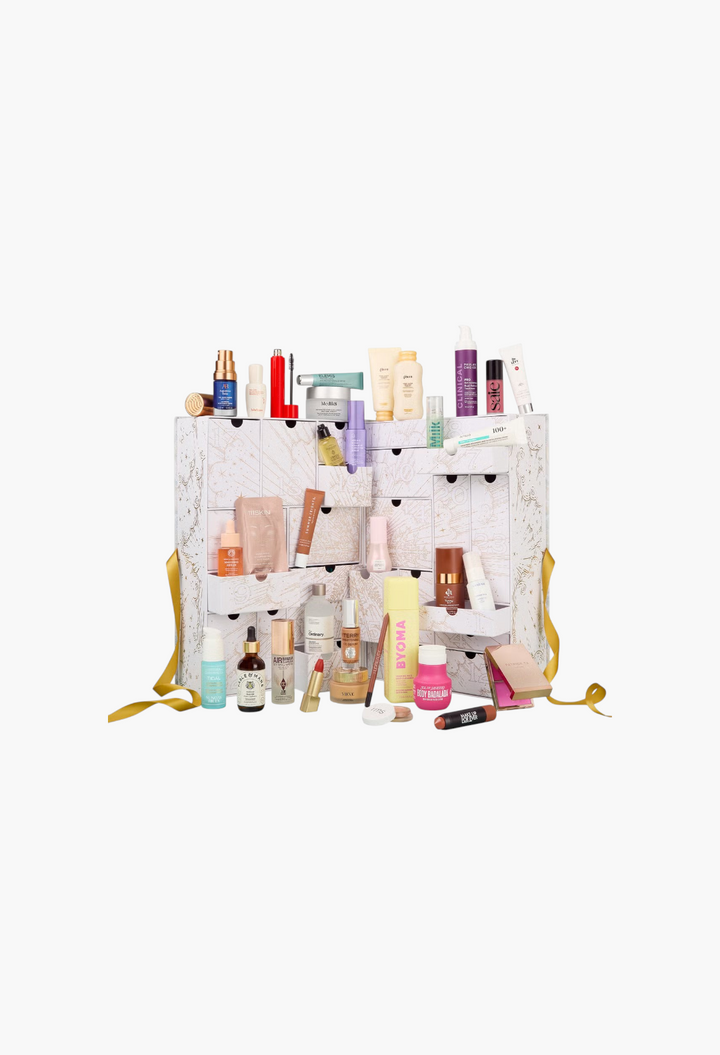 GLAM MODA beauty advent calendar featuring 33 skincare, makeup, and hair products in a white illustrated chest.