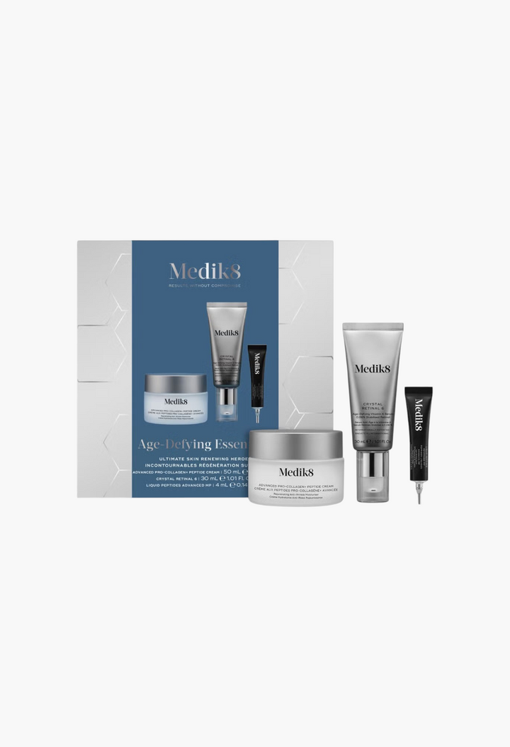 GLAM MODA Medik8 Age-Defying Essentials skincare set featuring pro-collagen cream, Crystal Retinal 6, and peptide serum.