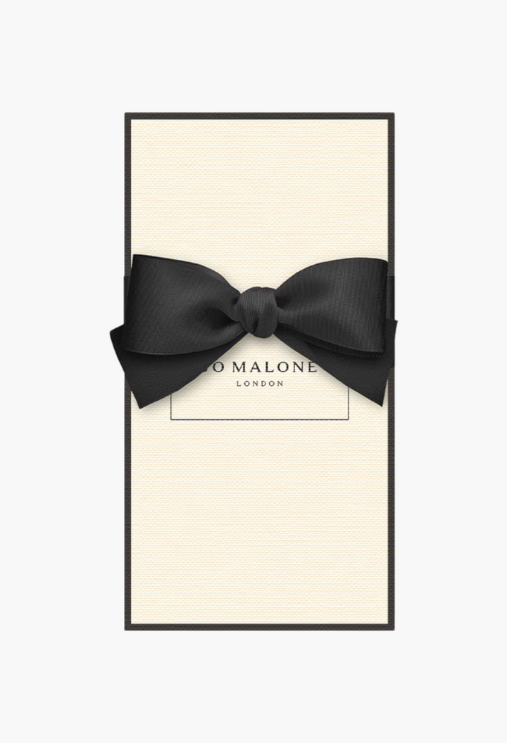 GLAM MODA English Oak & Hazelnut cologne gift box in cream with a black border and elegant black ribbon bow.