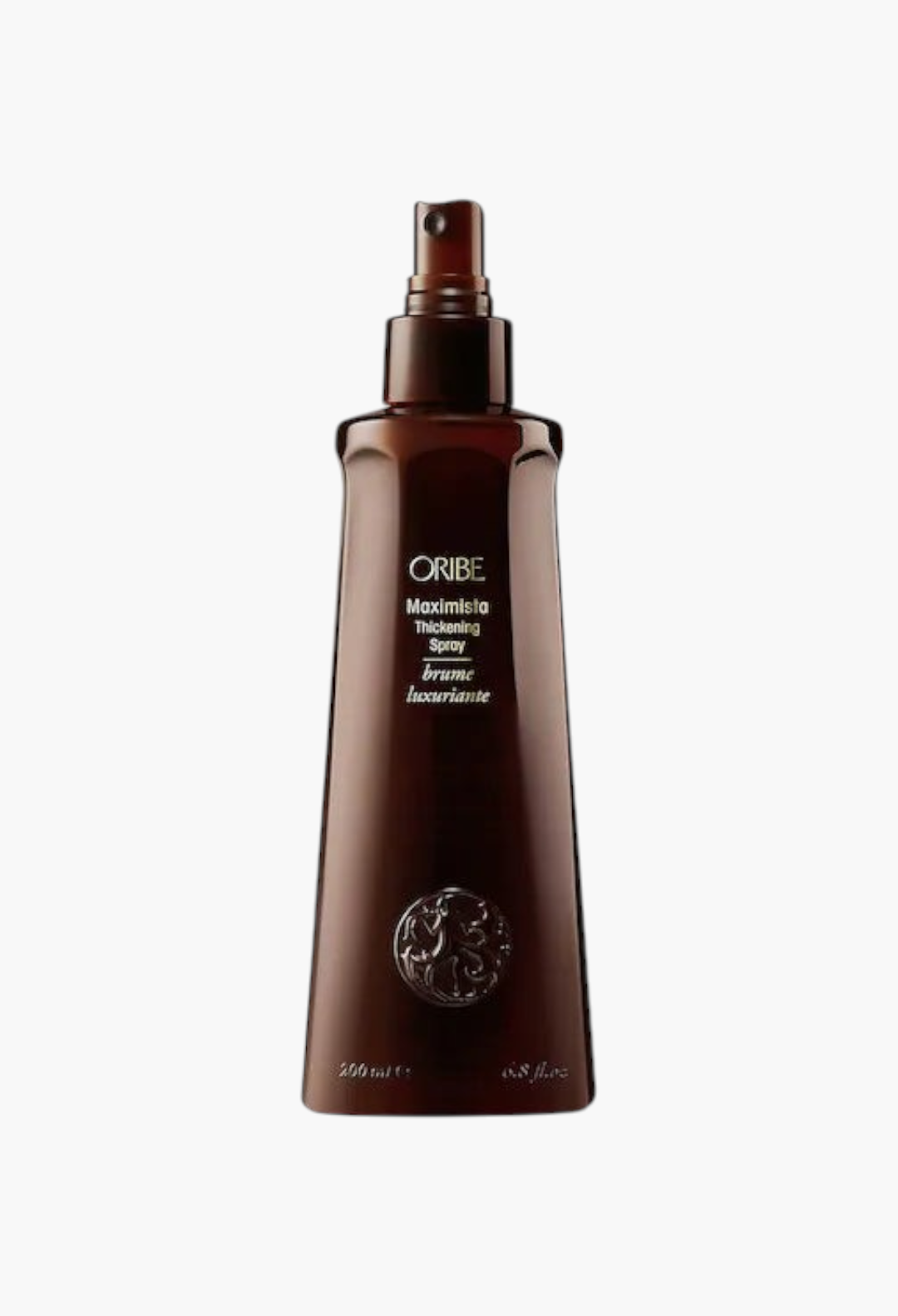 GLAM MODA Oribe Maximista thickening spray bottle for fine hair with thermal and UV protection in a brown container.