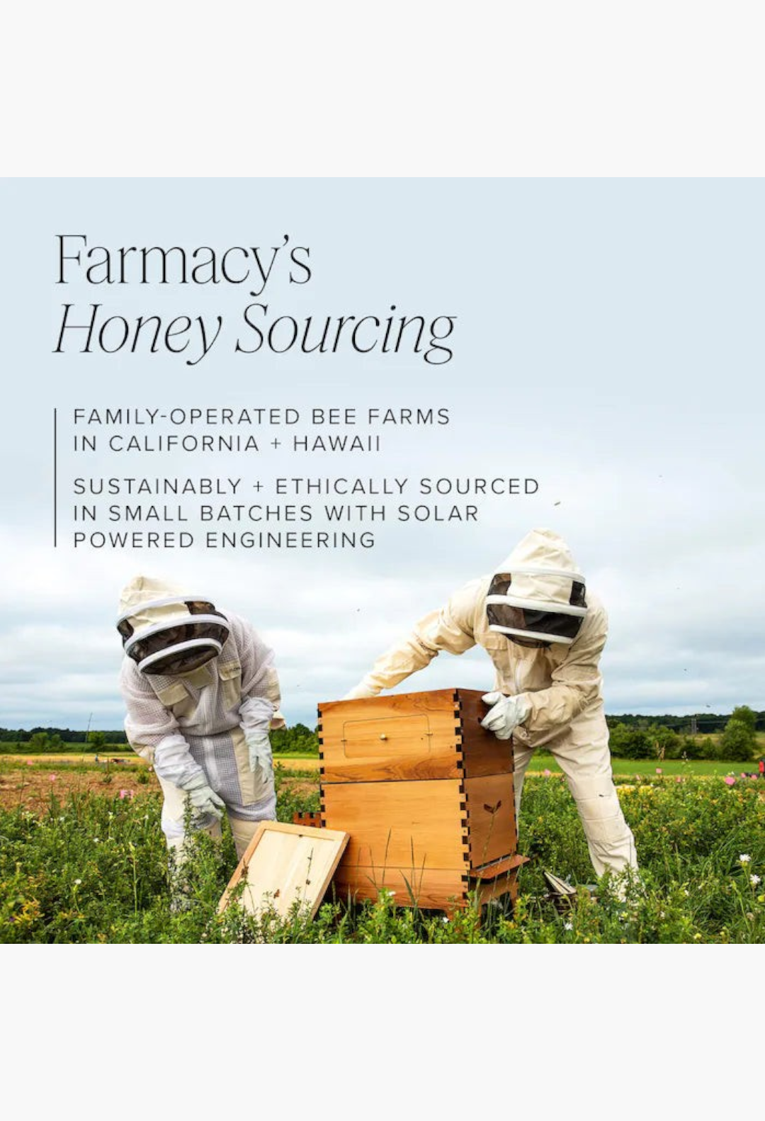 GLAM MODA beekeepers in protective suits tending to a wooden beehive in a field to harvest honey ingredients