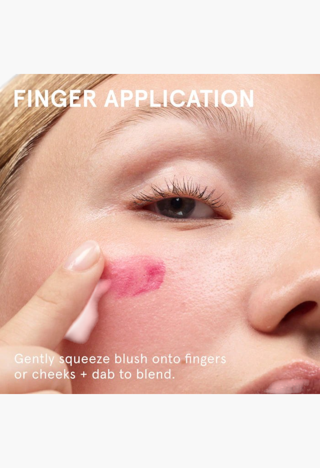 GLAM MODA Cloud Paint gel-cream blush being applied with a fingertip to the apple of a model's cheek for a dewy glow