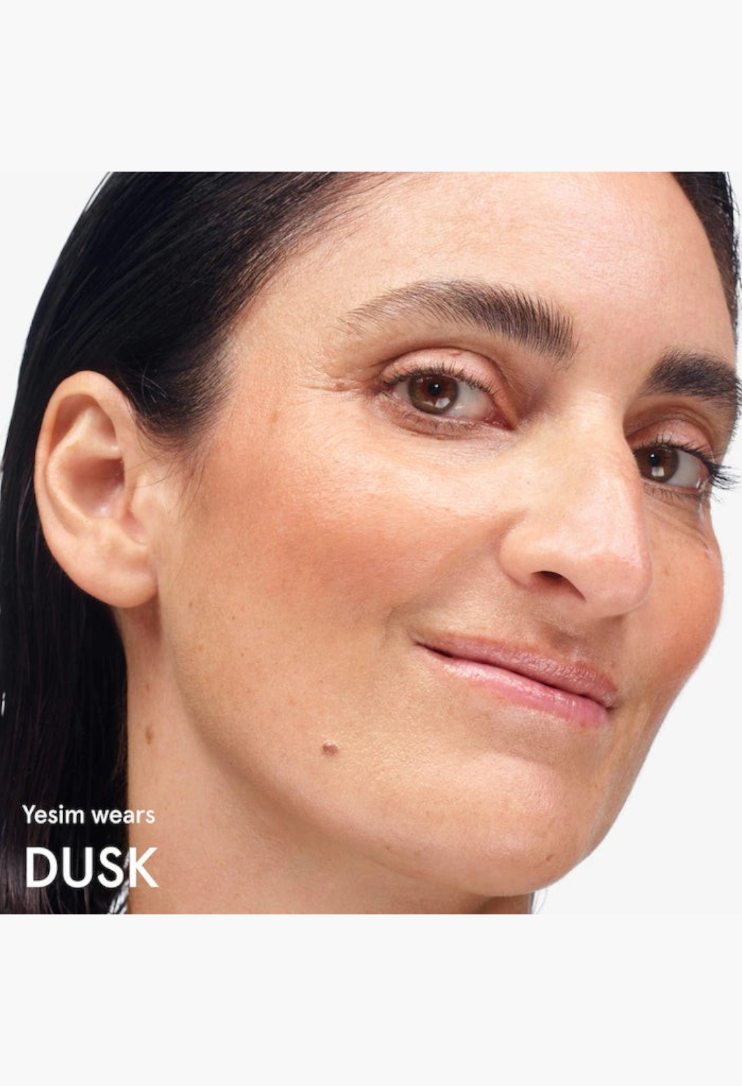 GLAM MODA Cloud Paint gel-cream blush in Dusk shade applied to a model's cheek for a natural dewy sunset flush