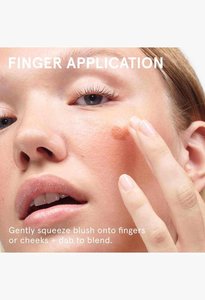 GLAM MODA Cloud Paint gel-cream blush being applied to a model's cheek with a fingertip for a natural dewy glow