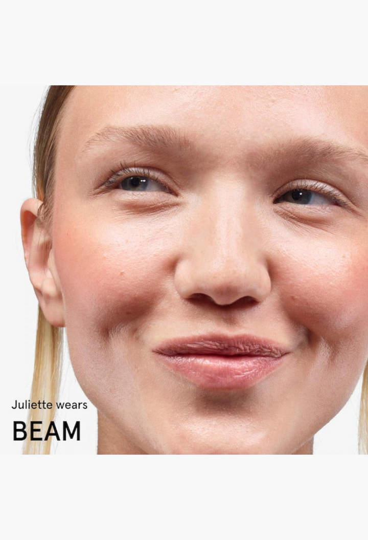 GLAM MODA Cloud Paint gel cream blush applied to a model's cheeks for a natural, dewy, sunset-inspired flush.