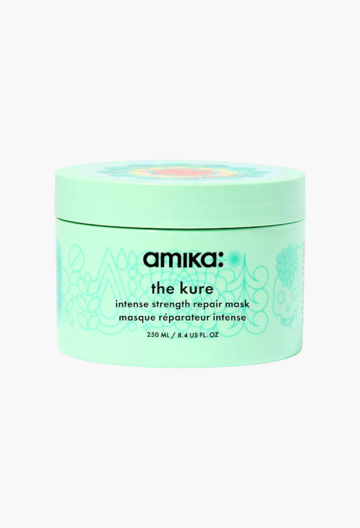 GLAM MODA amika The Kure Intense Strength Repair Hair Mask in a light green 250ml jar for damaged hair.