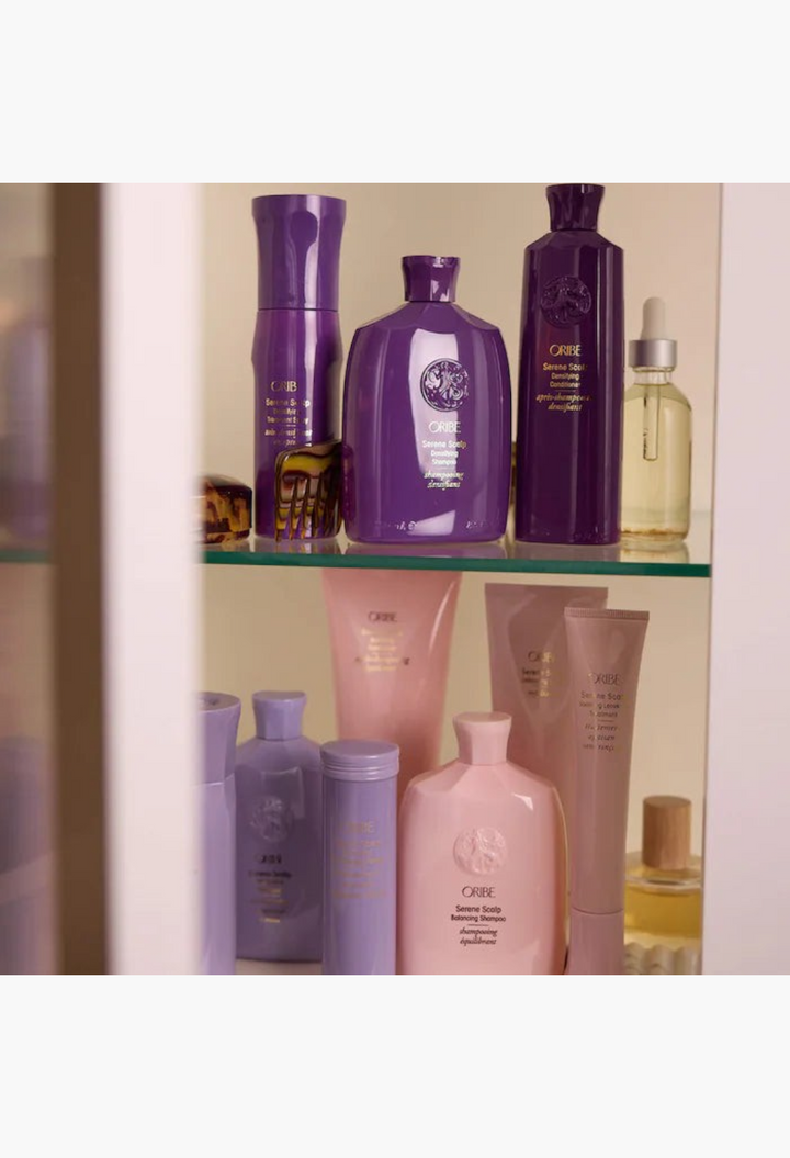 GLAM MODA collection of Oribe Serene Scalp hair care products including densifying conditioner and shampoo bottles.