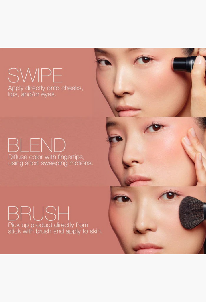 GLAM MODA model demonstrating application of the soft blur blush stick on cheeks with fingers and a makeup brush