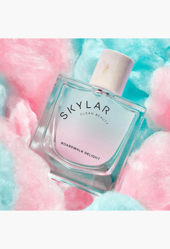 GLAM MODA Skylar Boardwalk Delight perfume bottle with a gradient blue and pink glass design and a light cap.
