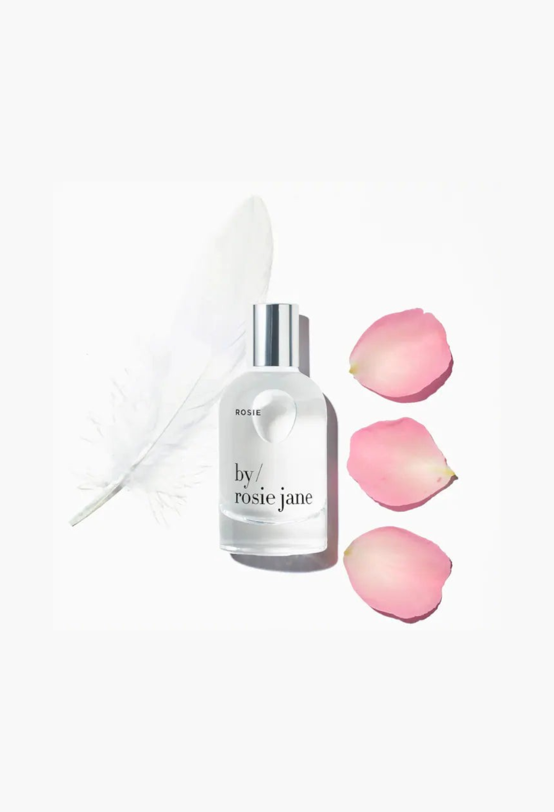 GLAM MODA By Rosie Jane Rosie eau de parfum bottle with a white feather and three pink rose petals on white background