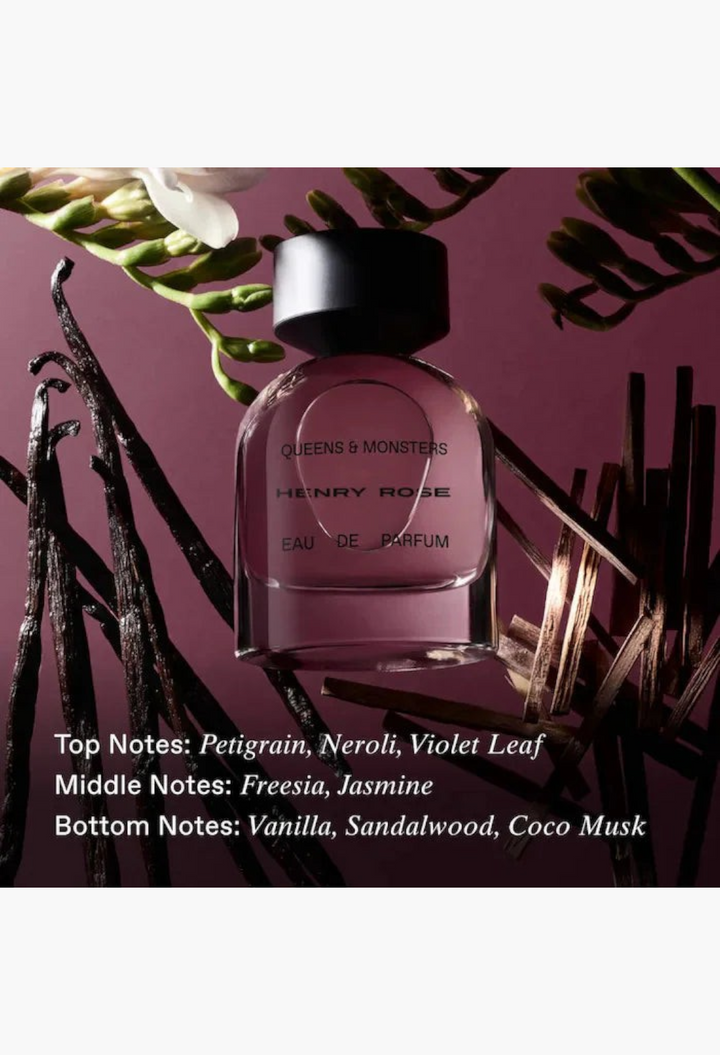 GLAM MODA Henry Rose Queens and Monsters perfume bottle surrounded by vanilla beans and freesia flowers