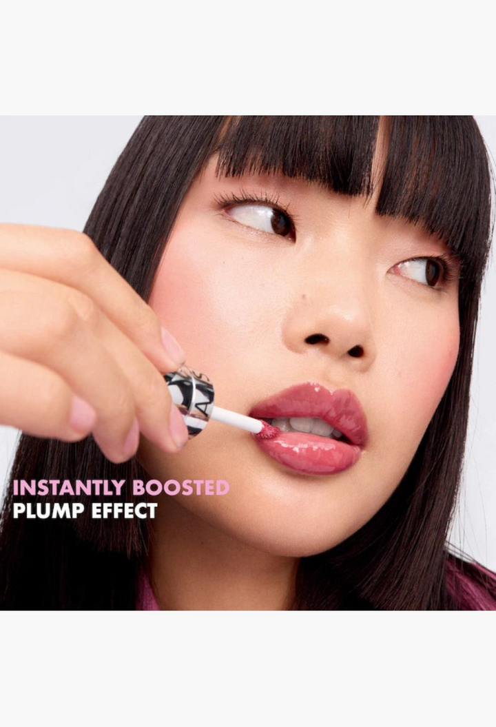 GLAM MODA Outrageous Lip Plumper gloss applied to lips for a shiny rosewood finish and instant plumping effect