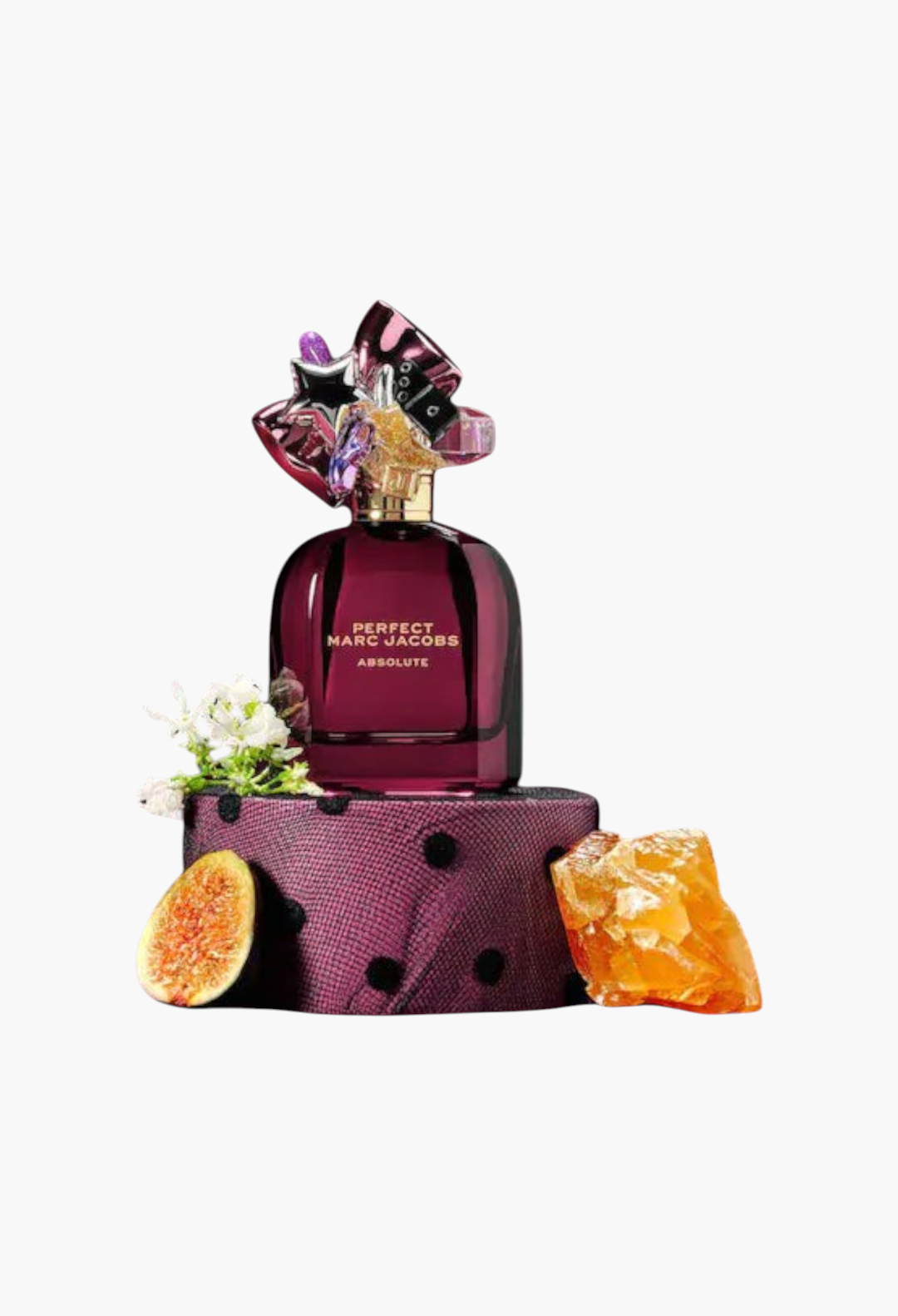 GLAM MODA Marc Jacobs Perfect Absolute perfume bottle on a decorative base with fig and amber accents