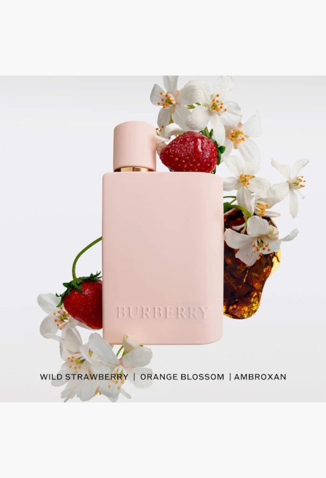 GLAM MODA Burberry Her perfume bottle in light pink with wild strawberry, orange blossom, and amber accents.
