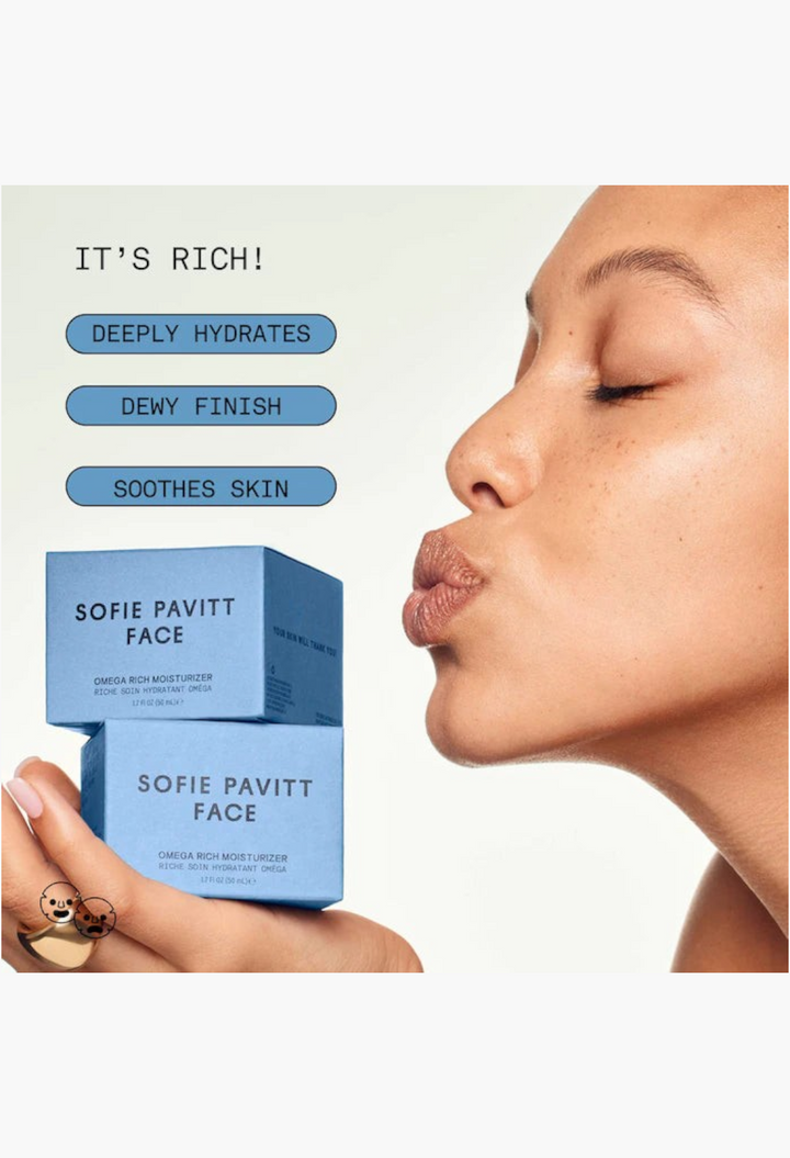 GLAM MODA model holding two blue Sofie Pavitt Face Omega Rich Moisturizer boxes with dewy skin and text overlays.
