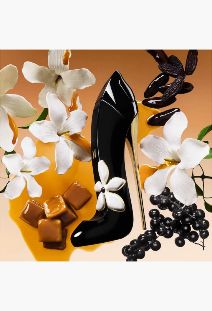 GLAM MODA Golden Hour perfume bottle shaped like a black stiletto heel surrounded by white flowers and caramel cubes.