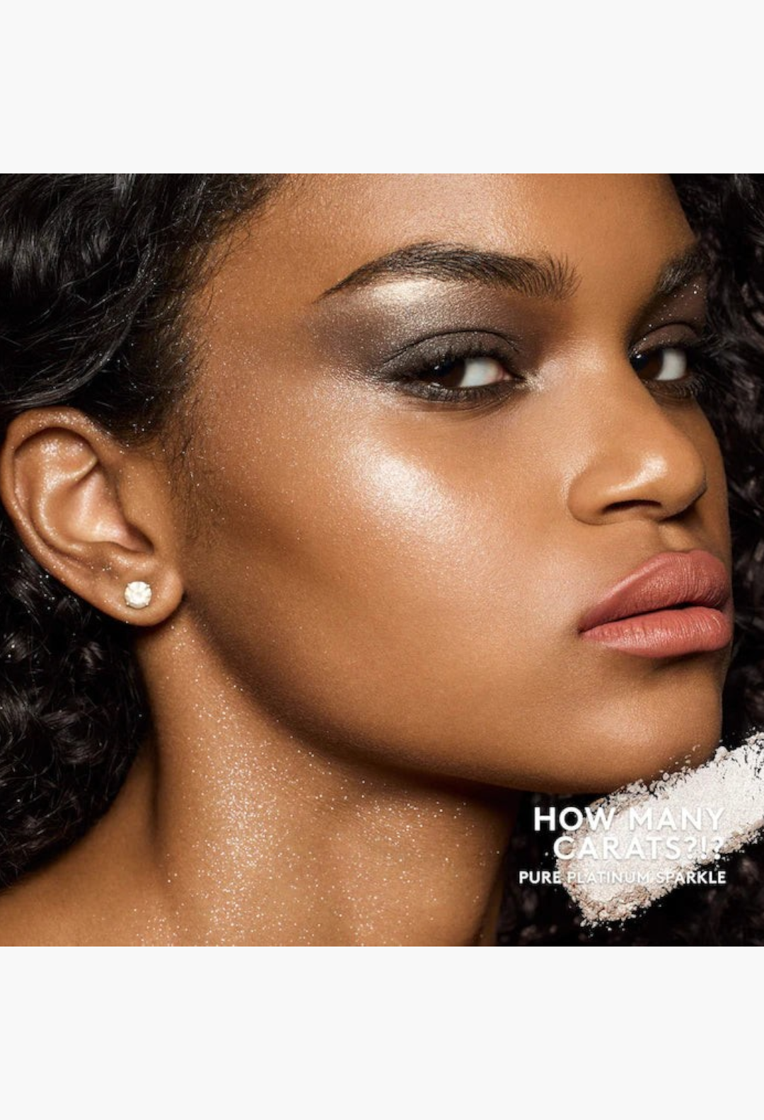 GLAM MODA model wearing shimmering highlighter and liquid blush for a radiant, sparkling makeup look