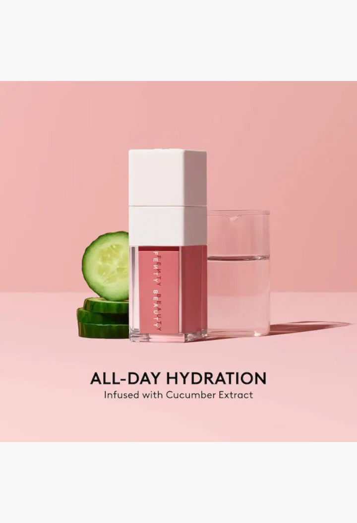 GLAM MODA liquid blush in a square bottle next to fresh cucumber slices and a glass of water on a pink background
