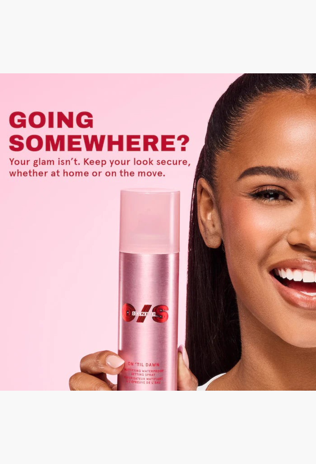 GLAM MODA On 'Til Dawn mattifying waterproof setting spray held by a smiling woman against a soft pink background