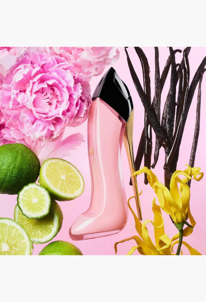 GLAM MODA perfume bottle shaped like a pink stiletto heel surrounded by fresh lime, vanilla beans, and peonies.