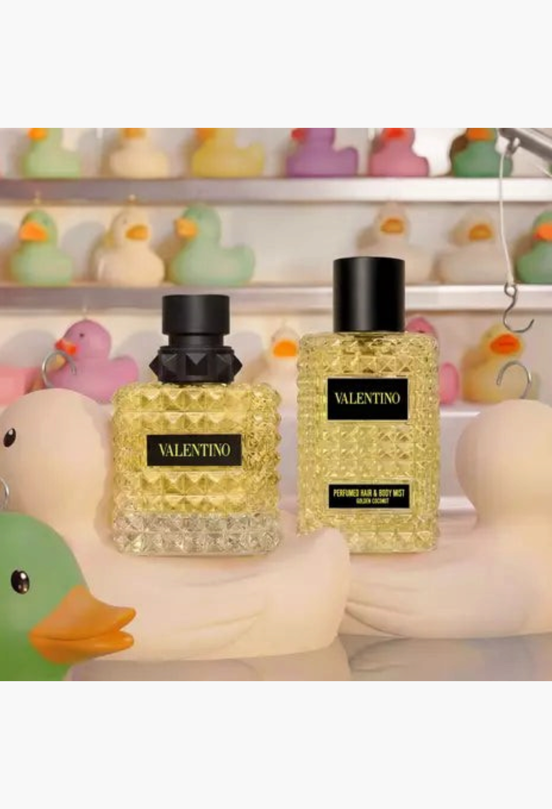 GLAM MODA Valentino Born In Roma Golden Coconut hair and body mist bottles with signature stud glass design